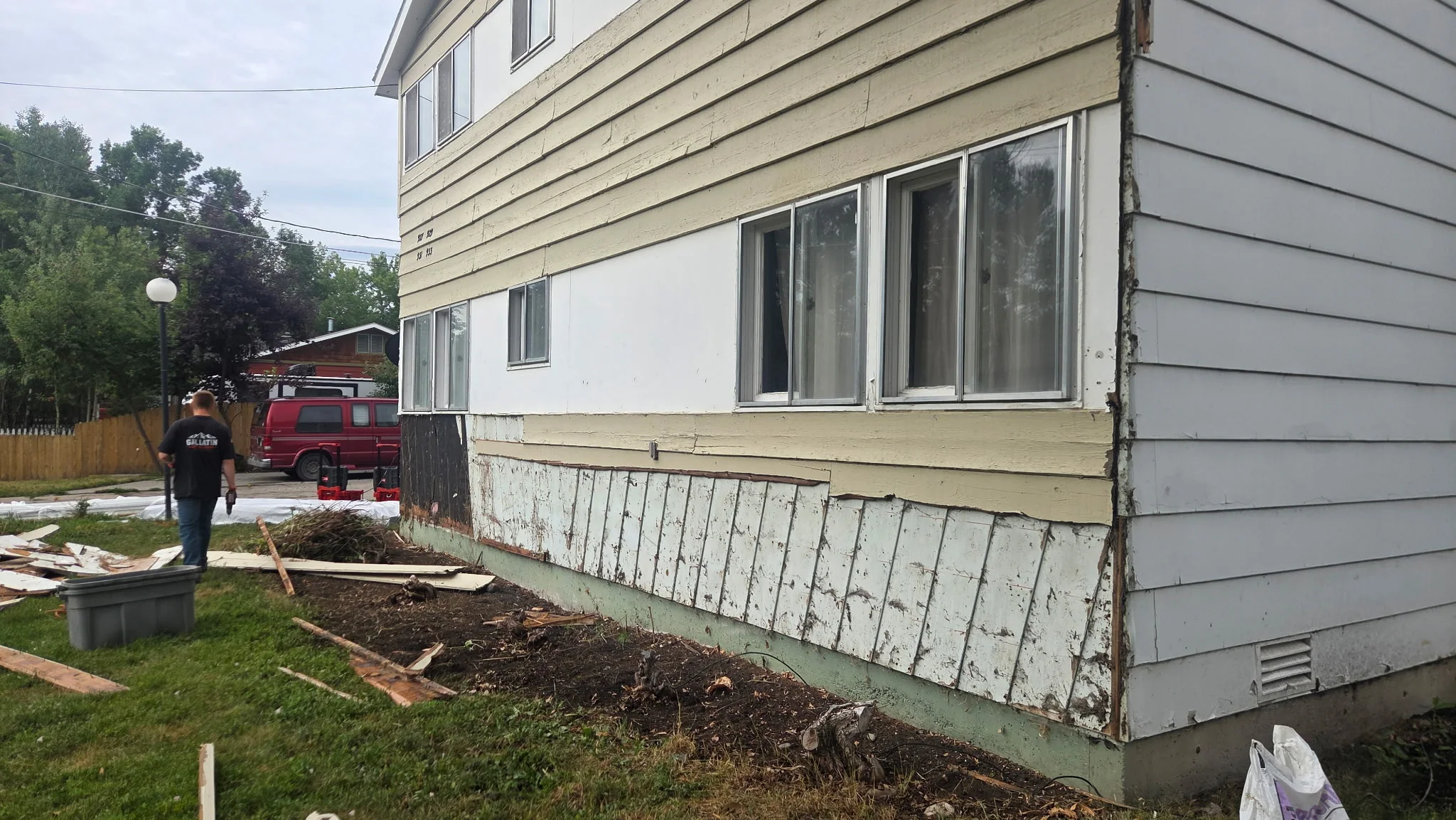 Another section of siding removal showing bare wall