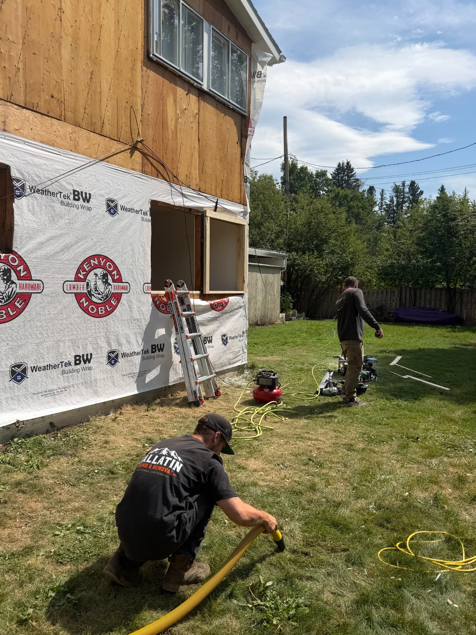 Final wall of siding removal, sheathing exposed