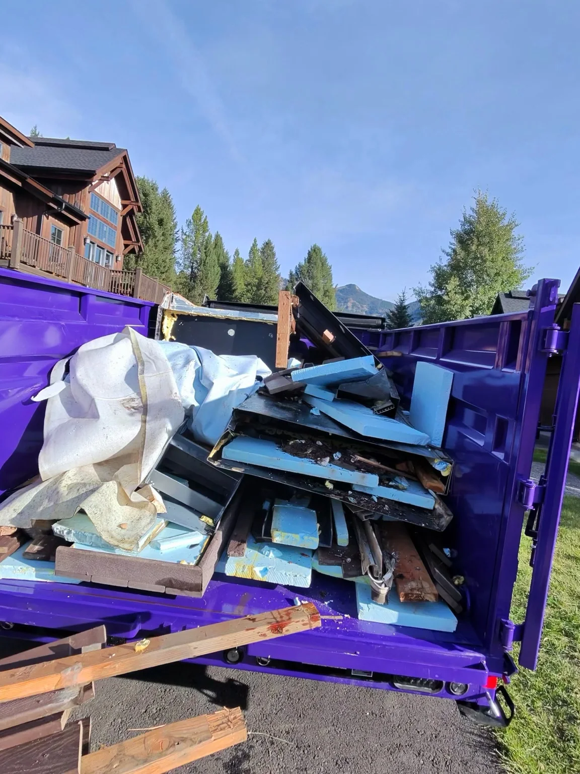 Hot tub debris loaded in dump trailer during haul-off