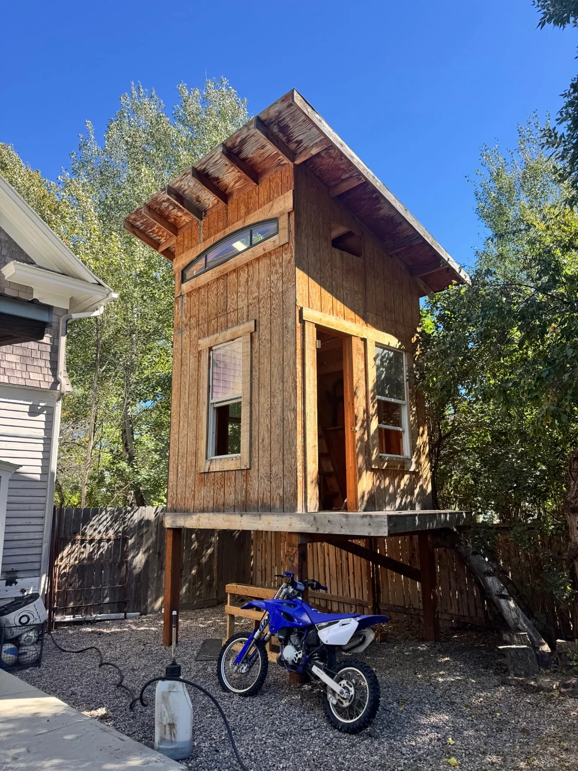 Treehouse and playhouse structure before removal in Livingston, Montana